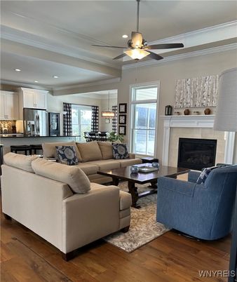 Dining room, Fireplace, Interior, Kitchen, Living room, Pendant Lights, Recessed Lighting, Stainless Steel Appliances, Wood Texture Flooring