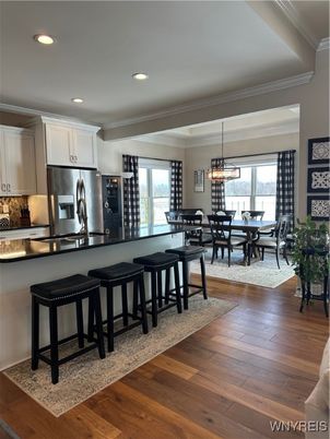 Chandelier, Dining room, Interior, Kitchen, Pendant Lights, Recessed Lighting, Stainless Steel Appliances, Wood Texture Flooring