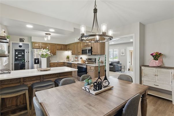 Chandelier, Dining room, Interior, Kitchen, Pendant Lights, Recessed Lighting, Stainless Steel Appliances, Wood Texture Flooring
