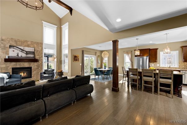 Dining room, Fireplace, Interior, Kitchen, Living room, Pendant Lights, Recessed Lighting, Stainless Steel Appliances, Stone Walls, Wooden Beams, Wood Texture Flooring