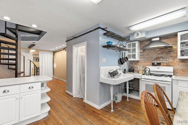 Interior, Kitchen, Recessed Lighting, Stainless Steel Appliances, Stone Walls, Wood Texture Flooring