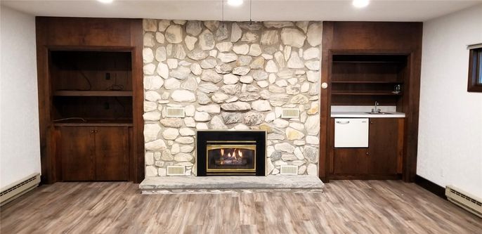 Fireplace, Interior, Recessed Lighting, Stone Walls, Wood Texture Flooring