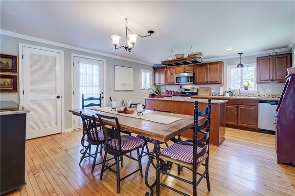 Chandelier, Dining room, Interior, Kitchen, Pendant Lights, Recessed Lighting, Stainless Steel Appliances, Wood Texture Flooring