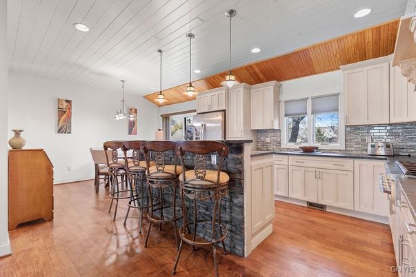 Dining room, Interior, Kitchen, Pendant Lights, Recessed Lighting, Stainless Steel Appliances, Wood Texture Flooring