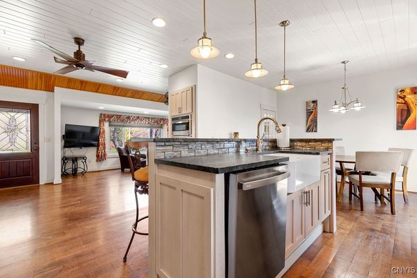 Dining room, Interior, Kitchen, Pendant Lights, Recessed Lighting, Stainless Steel Appliances, Wood Texture Flooring
