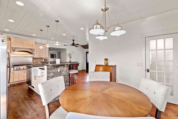 Dining room, Interior, Kitchen, Pendant Lights, Recessed Lighting, Stainless Steel Appliances, Wood Texture Flooring