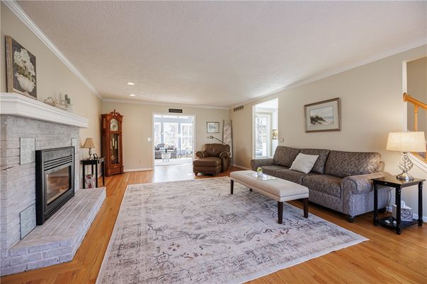 Fireplace, Interior, Living room, Recessed Lighting, Stone Walls, Wood Texture Flooring