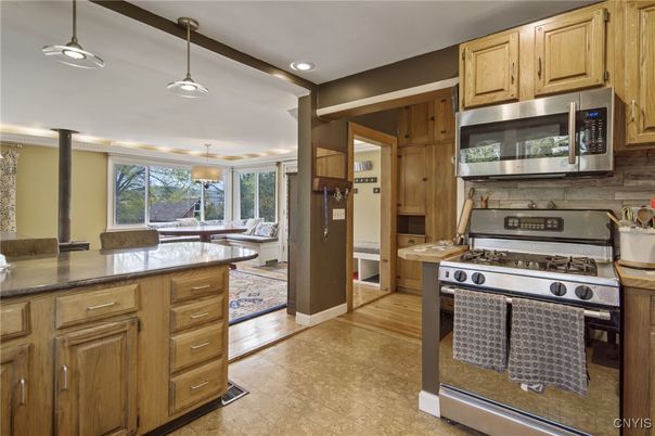 Dining room, Interior, Kitchen, Pendant Lights, Recessed Lighting, Stainless Steel Appliances, Wood Texture Flooring