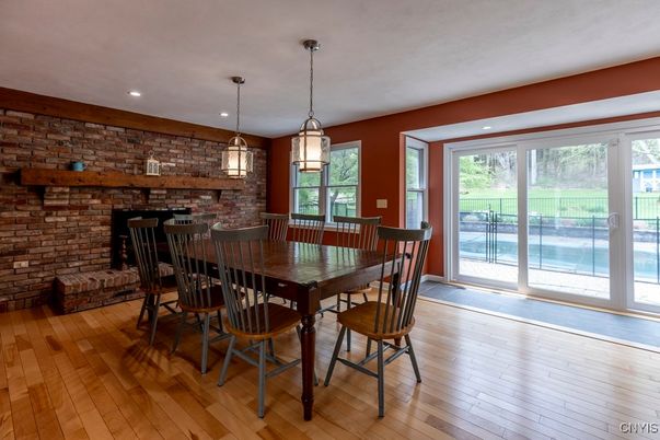 Dining room, Fireplace, Interior, Pendant Lights, Recessed Lighting, Stone Walls, Wood Texture Flooring
