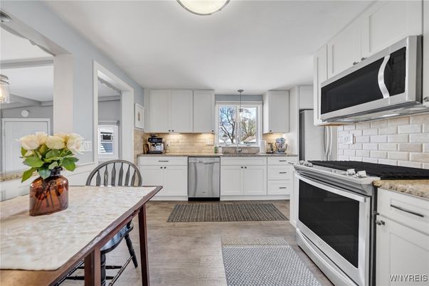 Dining room, Interior, Kitchen, Pendant Lights, Stainless Steel Appliances, Wood Texture Flooring