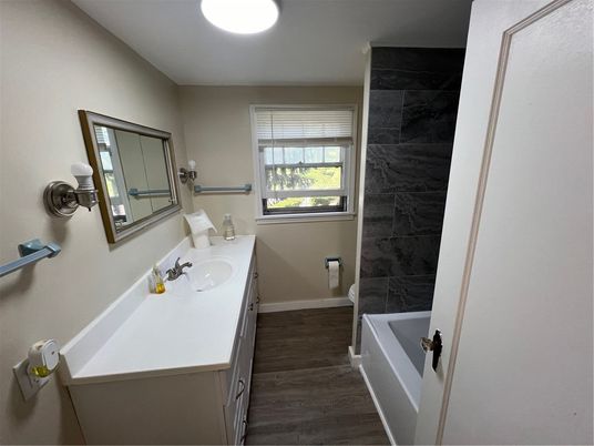 Bathroom, Dual Sink Vanities, Interior, Marble Walls, Wood Texture Flooring