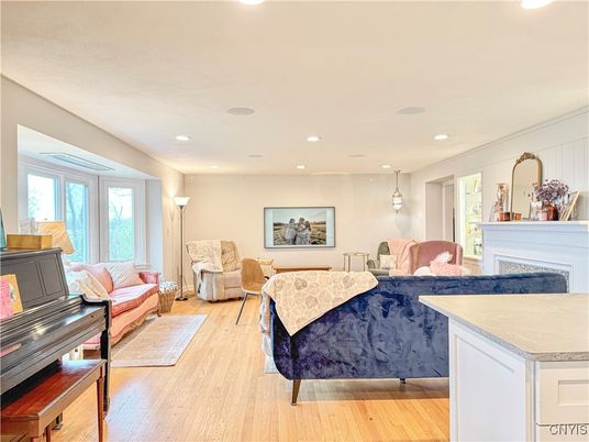 Fireplace, Interior, Living room, Pendant Lights, Piano, Recessed Lighting, Wood Texture Flooring