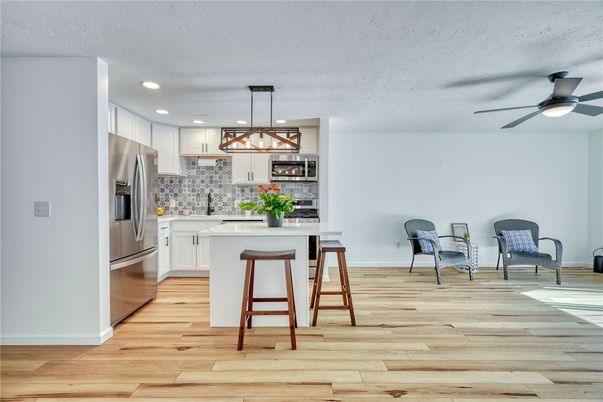 Interior, Kitchen, Pendant Lights, Recessed Lighting, Stainless Steel Appliances, Wood Texture Flooring