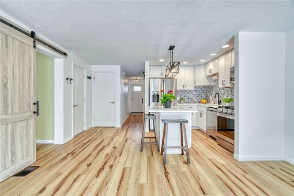 Interior, Kitchen, Pendant Lights, Recessed Lighting, Stainless Steel Appliances, Wood Texture Flooring