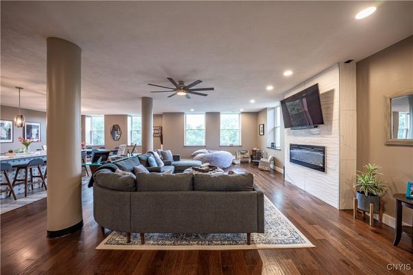 Dining room, Fireplace, Interior, Living room, Pendant Lights, Recessed Lighting, Wood Texture Flooring