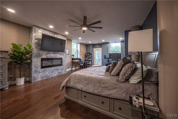 Bedroom, Fireplace, Interior, Recessed Lighting, Wood Texture Flooring