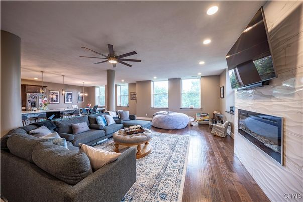 Dining room, Fireplace, Interior, Living room, Pendant Lights, Recessed Lighting, Wood Texture Flooring