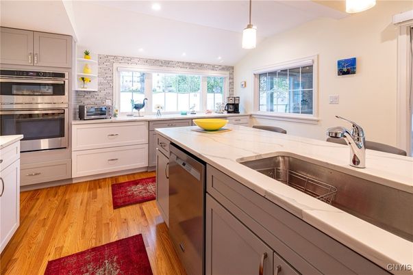 Interior, Kitchen, Pendant Lights, Recessed Lighting, Stainless Steel Appliances, Tile Countertops, Wood Texture Flooring