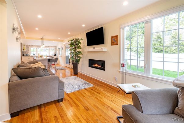 Dining room, Fireplace, Interior, Living room, Pendant Lights, Recessed Lighting, Wood Texture Flooring