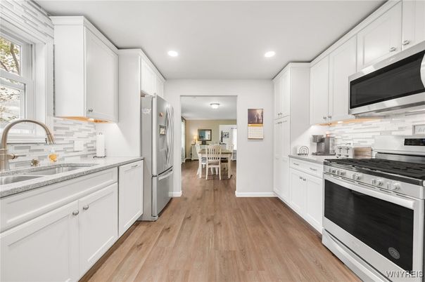 Dining room, Interior, Kitchen, Recessed Lighting, Stainless Steel Appliances, Wood Texture Flooring
