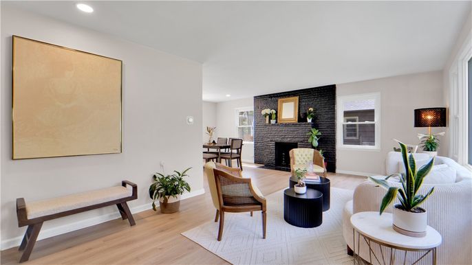 Dining room, Fireplace, Interior, Living room, Recessed Lighting, Stone Walls, Wood Texture Flooring