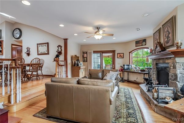 Dining room, Fireplace, Interior, Living room, Recessed Lighting, Wood Texture Flooring