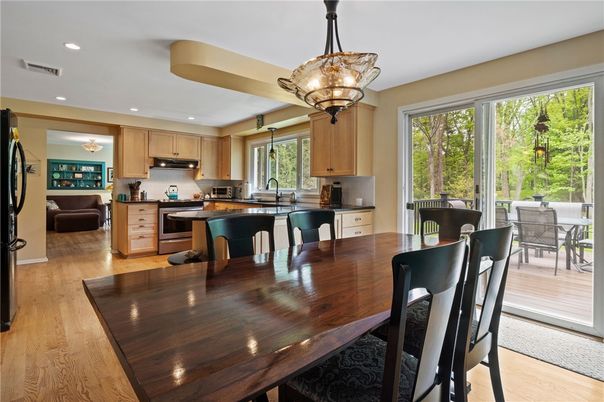 Chandelier, Dining room, Interior, Kitchen, Recessed Lighting, Stainless Steel Appliances, Wood Texture Flooring