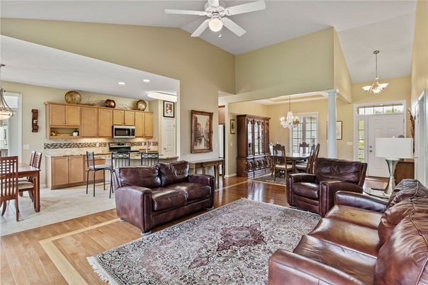 Chandelier, Dining room, Interior, Kitchen, Living room, Pendant Lights, Recessed Lighting, Stainless Steel Appliances, Wood Texture Flooring