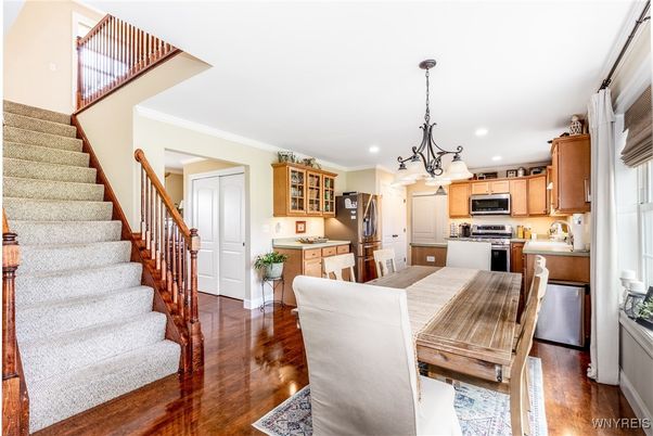 Chandelier, Dining room, Interior, Kitchen, Recessed Lighting, Stainless Steel Appliances, Wood Texture Flooring