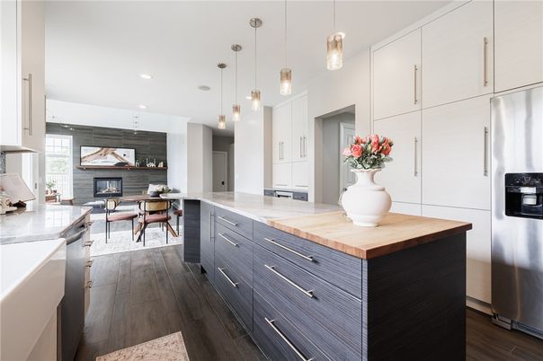 Dining room, Fireplace, Interior, Kitchen, Pendant Lights, Recessed Lighting, Stainless Steel Appliances, Wood Texture Flooring