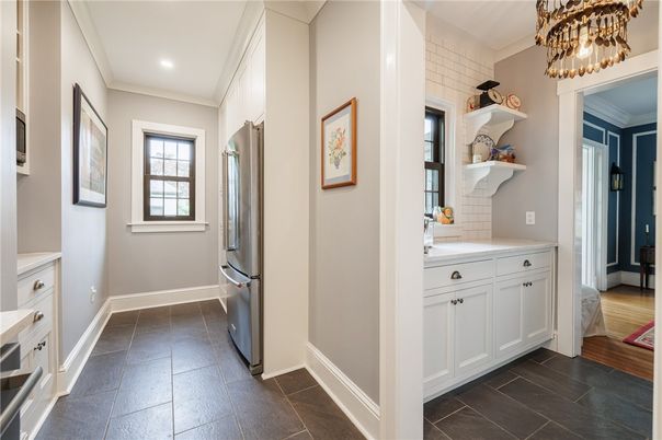 Interior, Kitchen, Recessed Lighting, Washer, Wood Texture Flooring