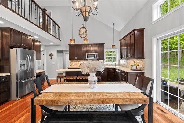 Dining room, Interior, Kitchen, Pendant Lights, Recessed Lighting, Stainless Steel Appliances, Wood Texture Flooring