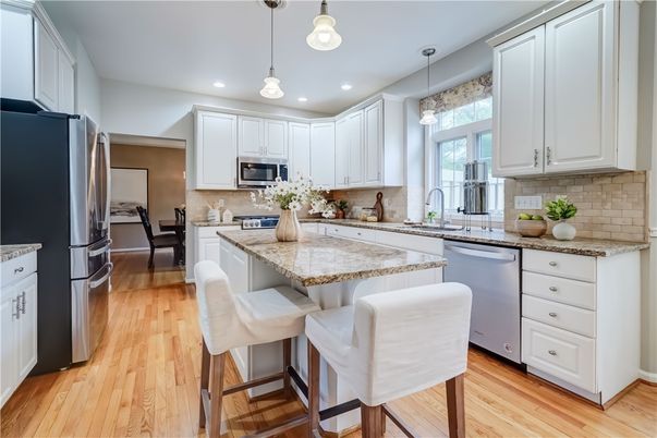 Dining room, Interior, Kitchen, Pendant Lights, Recessed Lighting, Stainless Steel Appliances, Wood Texture Flooring