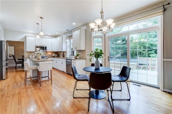 Chandelier, Dining room, Interior, Kitchen, Pendant Lights, Recessed Lighting, Stainless Steel Appliances, Wood Texture Flooring