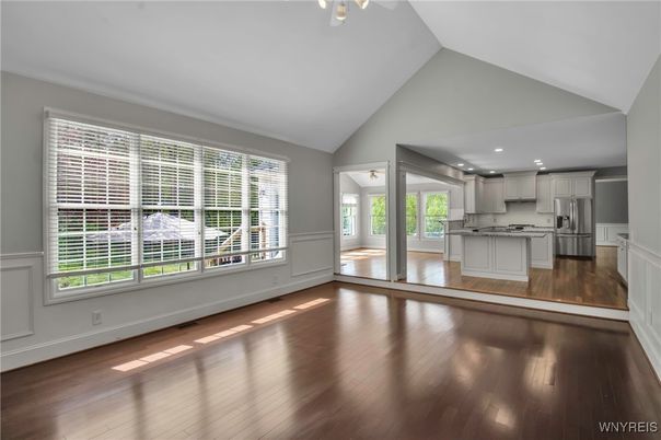 Empty room, Interior, Kitchen, Recessed Lighting, Stainless Steel Appliances, Wood Texture Flooring