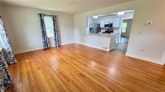Empty room, Interior, Kitchen, Stainless Steel Appliances, Wood Texture Flooring