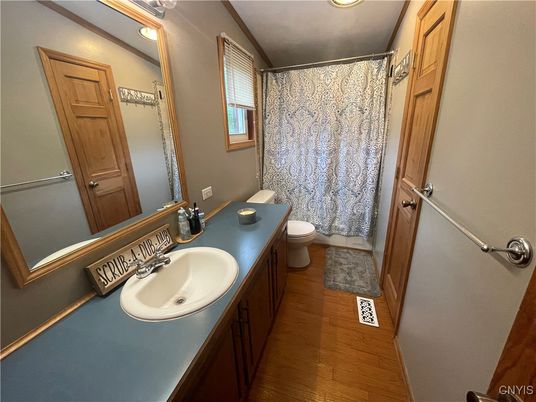 Bathroom, Dual Sink Vanities, Interior, Recessed Lighting, Wood Texture Flooring