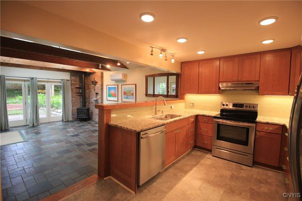 Interior, Kitchen, Recessed Lighting, Stainless Steel Appliances, Stone Walls