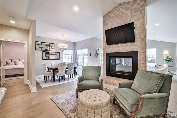 Chandelier, Dining room, Fireplace, Interior, Recessed Lighting, Stone Walls, Wood Texture Flooring