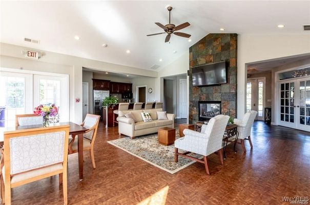 Dining room, Fireplace, Interior, Kitchen, Living room, Recessed Lighting, Stone Walls, Wood Texture Flooring