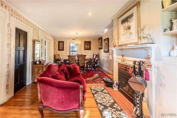 Chandelier, Dining room, Fireplace, Interior, Living room, Recessed Lighting, Wood Texture Flooring