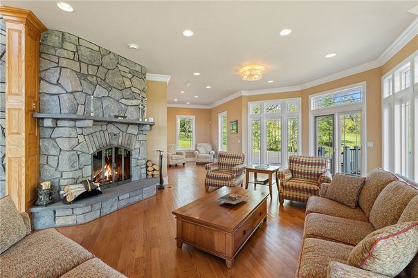 Fireplace, Interior, Living room, Recessed Lighting, Stone Walls, Wood Texture Flooring