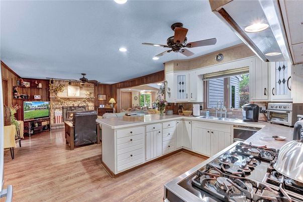 Dining room, Fireplace, Interior, Kitchen, Recessed Lighting, Stone Walls, Wood Texture Flooring, Wooden Walls