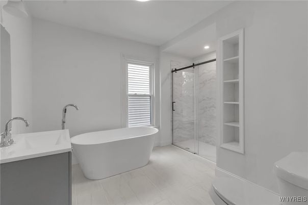 Bathroom, Free Standing Baths, Glass Shower, Interior, Marble, Marble Walls, Recessed Lighting