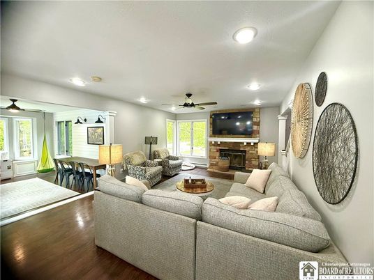 Dining room, Fireplace, Interior, Living room, Recessed Lighting, Wood Texture Flooring