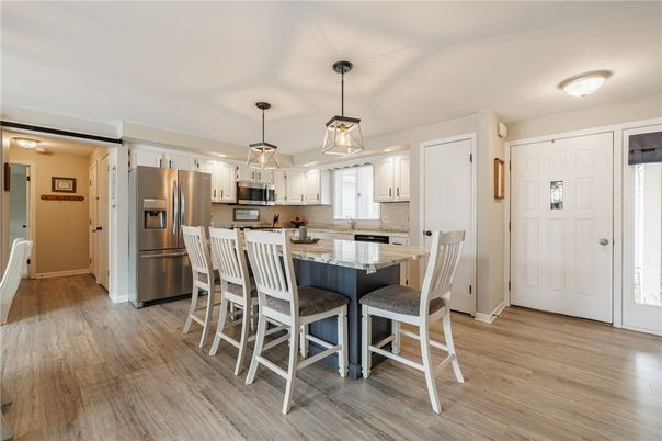 Dining room, Interior, Kitchen, Pendant Lights, Stainless Steel Appliances, Wood Texture Flooring