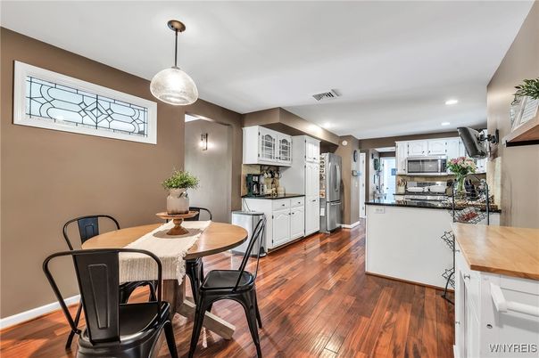 Dining room, Interior, Kitchen, Recessed Lighting, Stainless Steel Appliances, Wood Texture Flooring