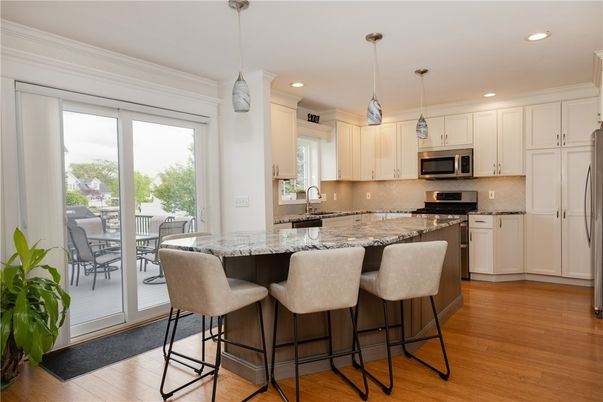Dining room, Interior, Kitchen, Pendant Lights, Recessed Lighting, Stainless Steel Appliances, Wood Texture Flooring
