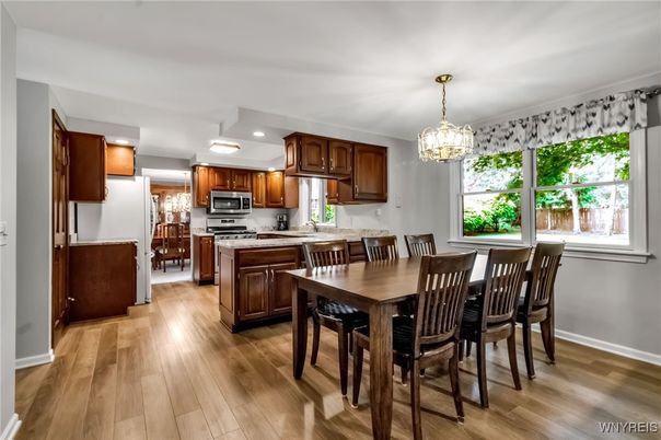 Chandelier, Dining room, Interior, Kitchen, Pendant Lights, Recessed Lighting, Stainless Steel Appliances, Wood Texture Flooring