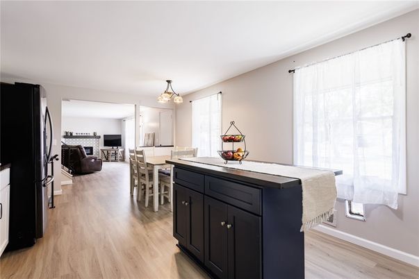 Dining room, Fireplace, Interior, Pendant Lights, Wood Texture Flooring